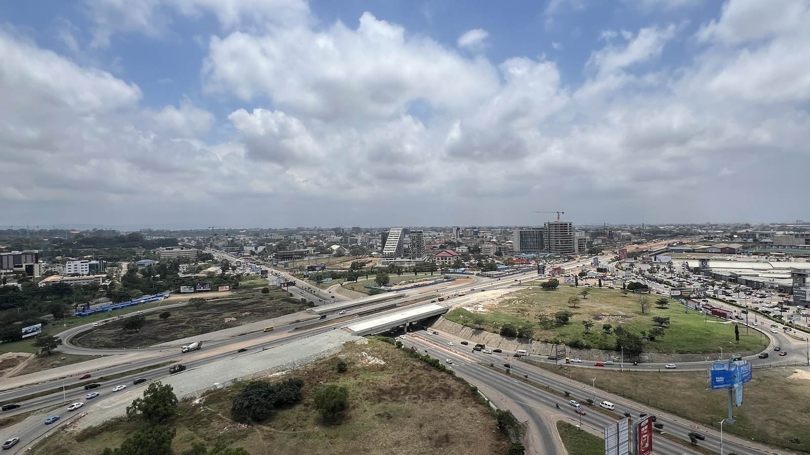 An aerial view of a new road interchange and its green corridor