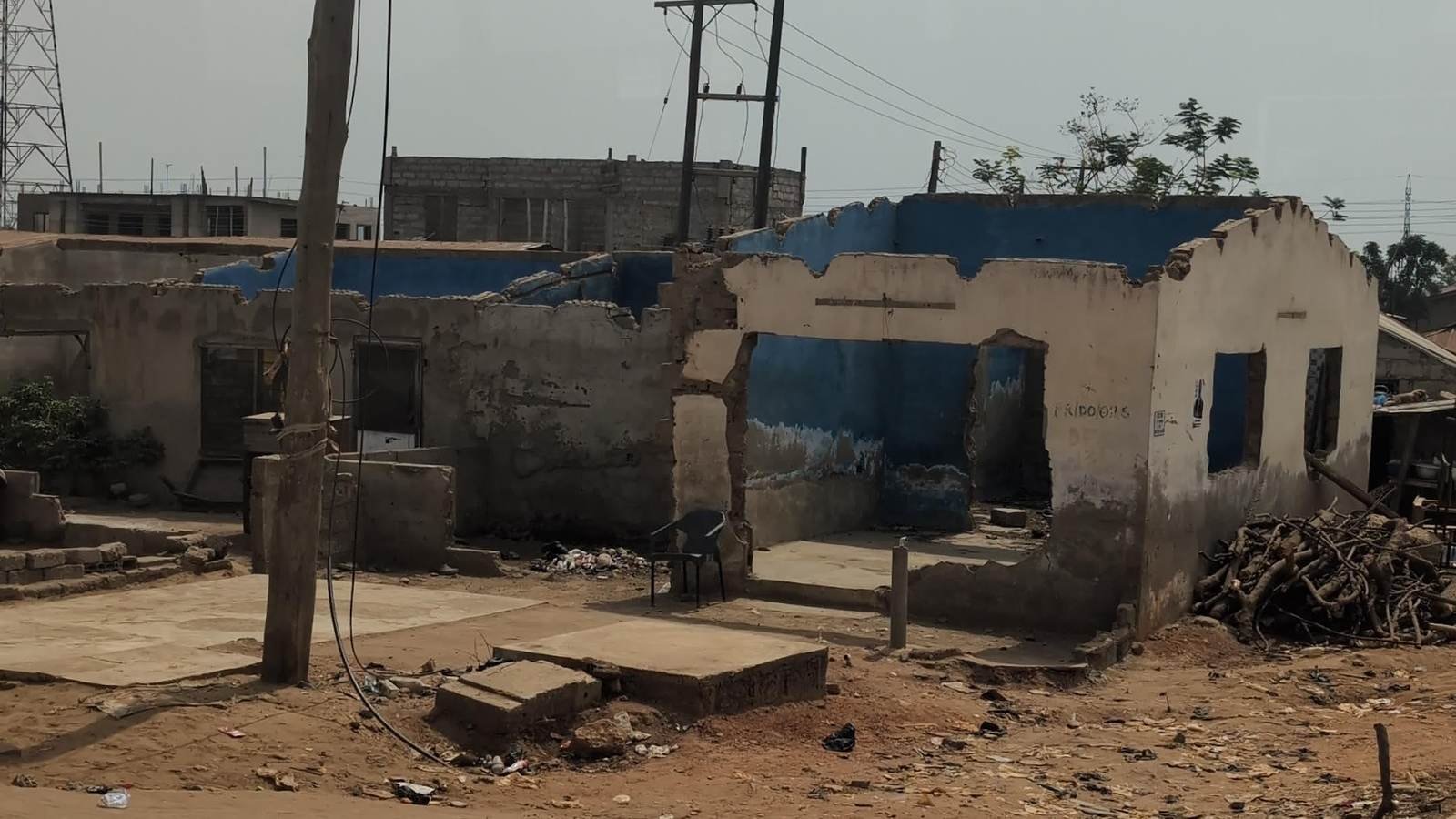 A half-cleared plot with demolished structures and exposed ground